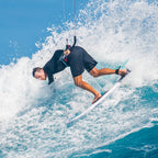 Rider on a wave with the Slingshot Impact XR V1 kitesurf board