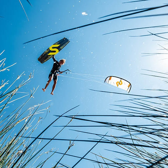 Slingshot Code V3 Kite - rider in the air above reeds (square crop test)