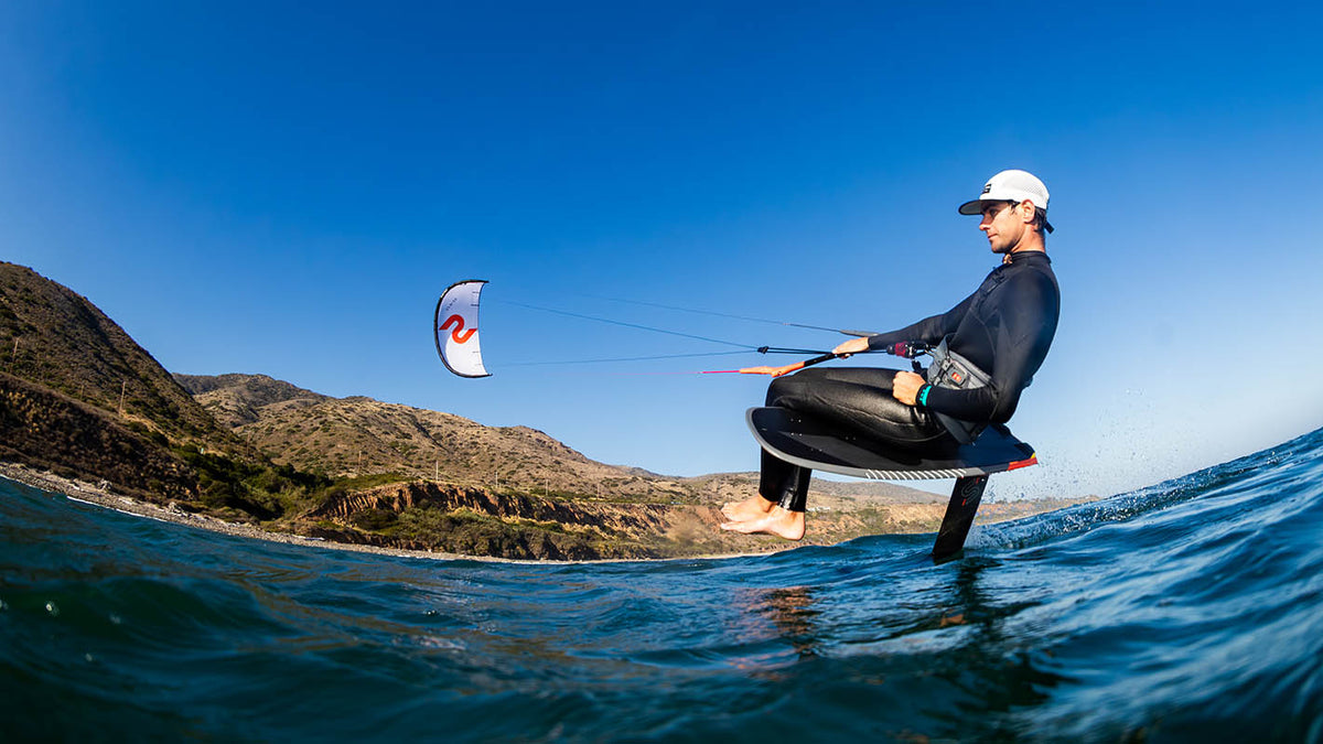 Slingshot UFO V4 Kite - foil rider seated on the board