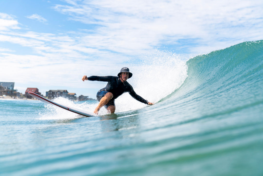 Surfer exploring Cape Hatteras with a custom REAL Surf Guide