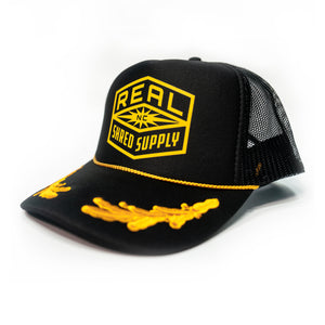 REAL Shred Supply Trucker Hat-Black/Gold